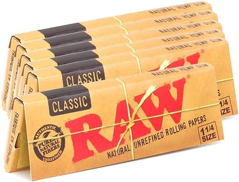 Experience RAW Classic 1¼ Rolling Papers - pure, unbleached, and criss-cross watermarked for a smooth burn. Sealed with natural acacia gumline, each pack holds 50 sheets, perfect for your rolling needs. Embrace the essence of RAW's craftsmanship. Buy Today From Your #1 Online Smoke  & Vape Shop Vape Bazaar!