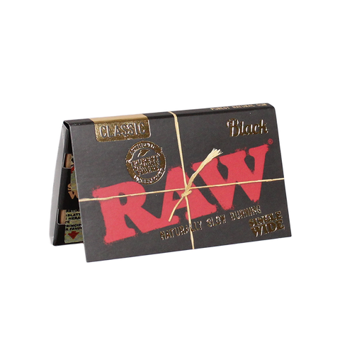 Experience smoking perfection with RAW Black Single Wide Double Feed Rolling Papers. Crafted in Spain's Benimarfull region, these ultra-thin, unbleached papers let you taste every terpene. Elevate your roll with this artisanal masterpiece. Get yours now at your #1 Online Vape & Smoke Shop, Vape Bazaar.